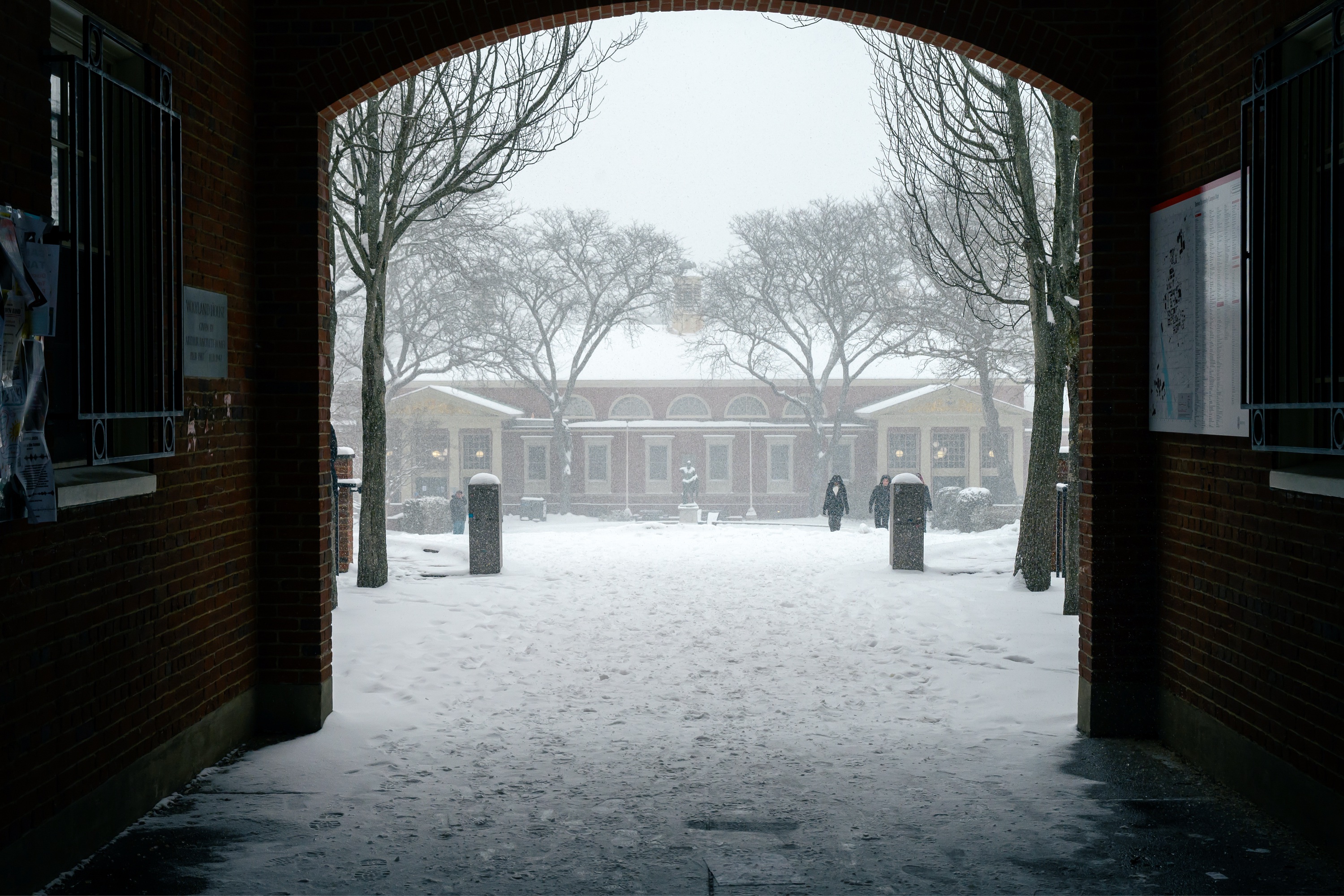 Photo of Wayland Arch looking out upon a snow-covered Sharpe Refectory.