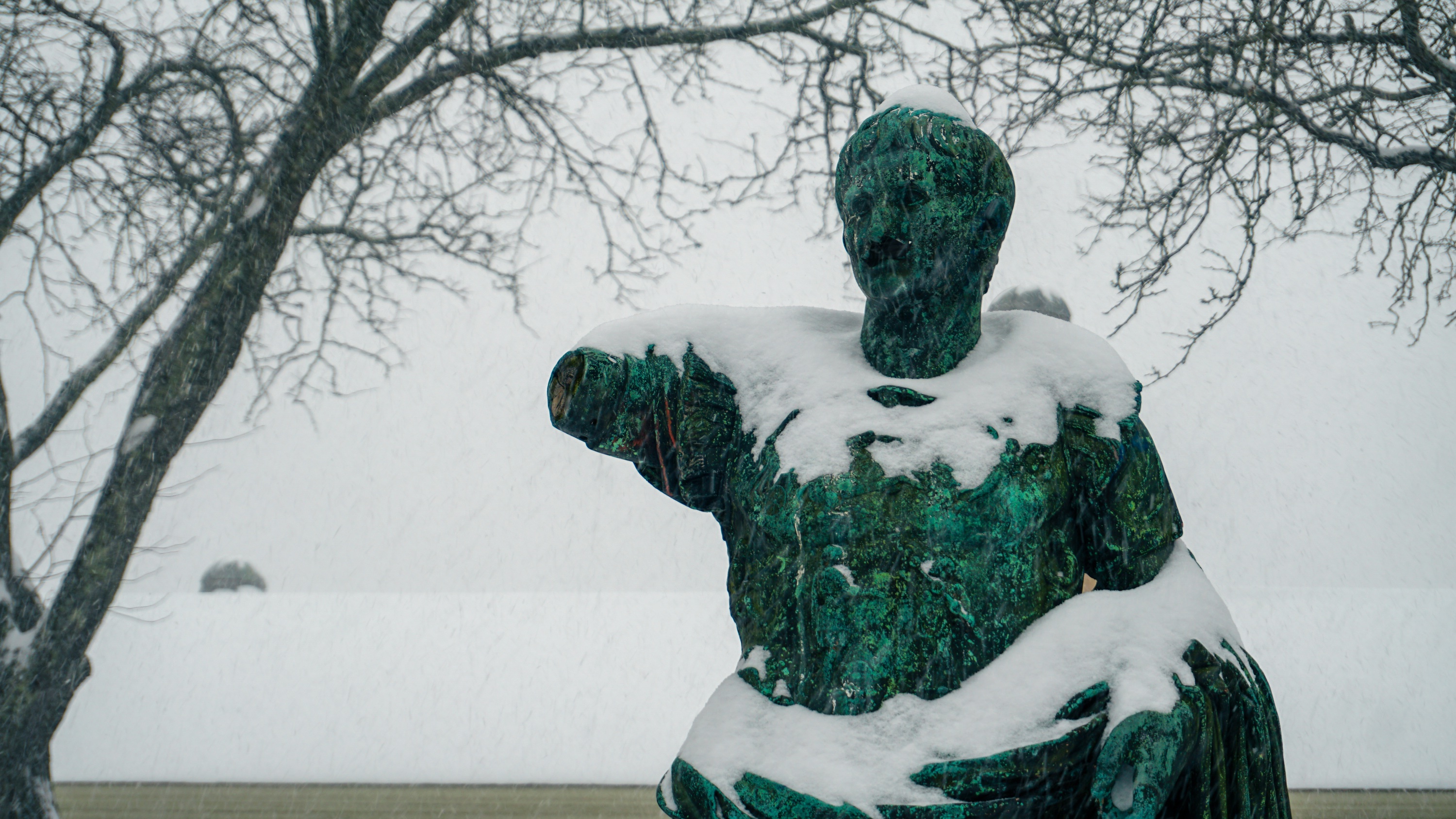 Photo of Augustus Caesar statue cloaked in snow.